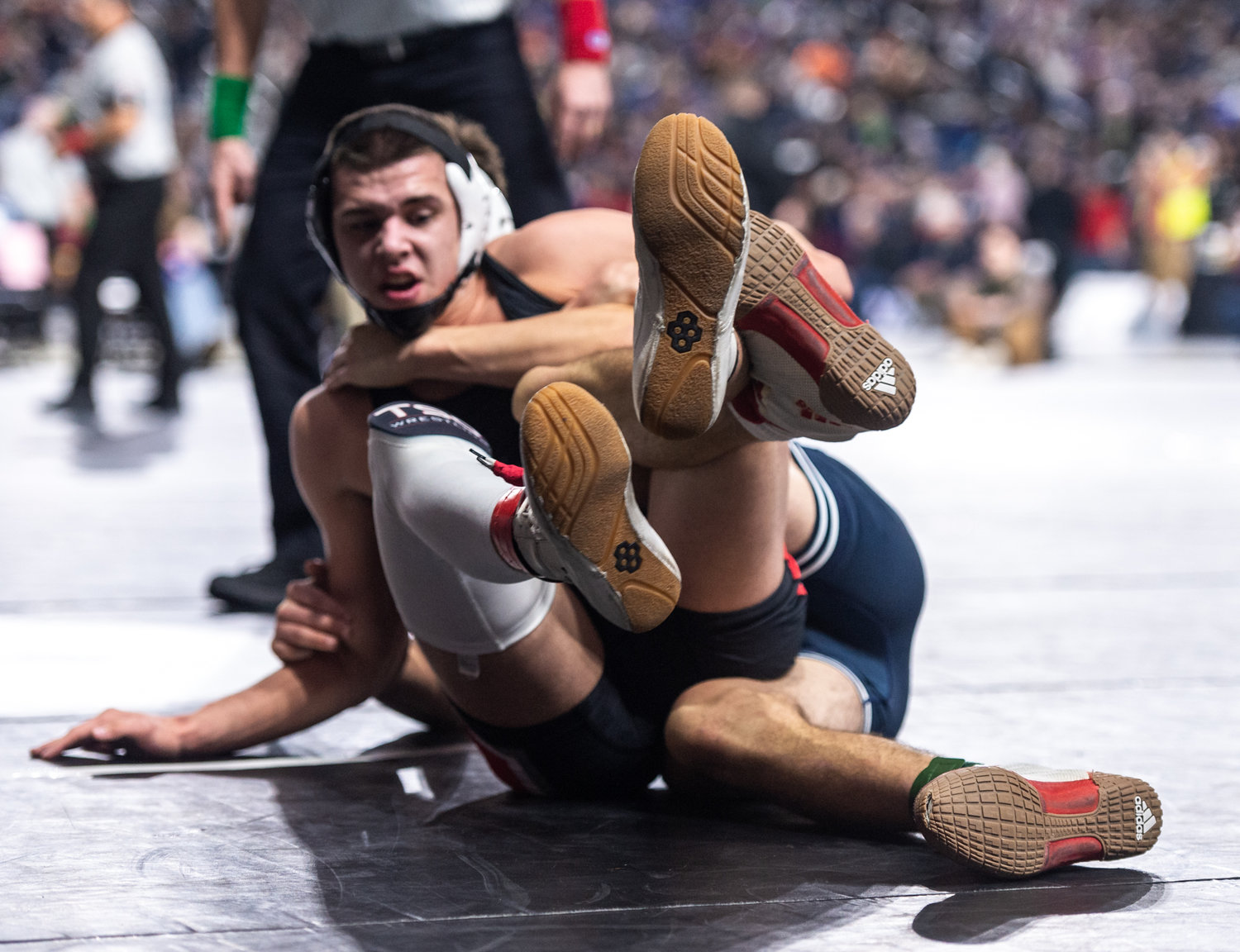 Tenino’s Kysen Knox, 170 pounds, competes against  Cascade Christian’s Clayton Qualey at Mat Classic XXXIV on Friday, February 17, 2023, at the Tacoma Dome. (Joshua Hart/For The Chronicle)